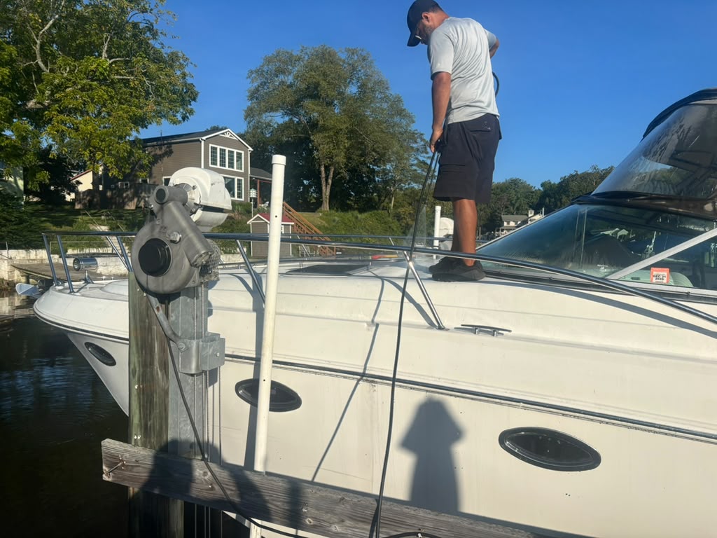Boat receiving exterior care at an approved dockside location